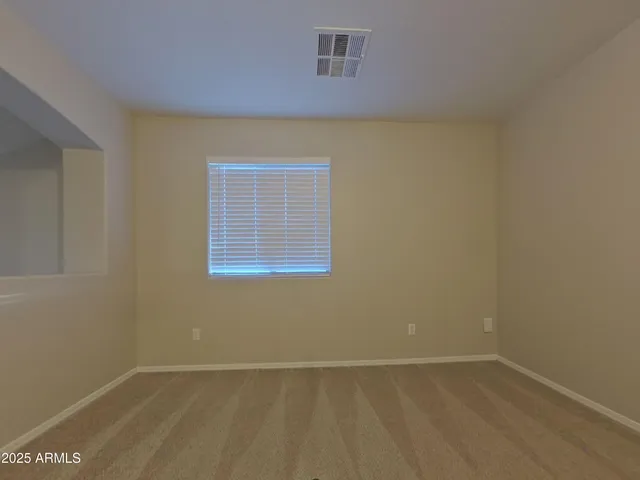 a white toilet sitting next to a bath tub
