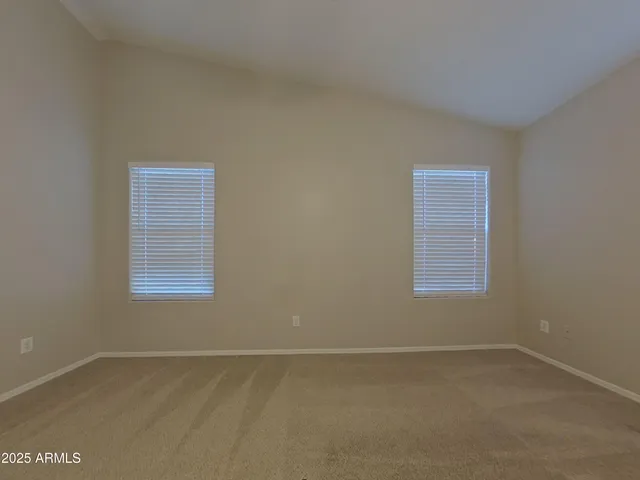 a kitchen with granite countertop cabinets sink and white appliances