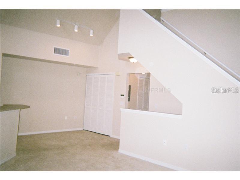 5581 Rosehill Road, Unit 203 Sarasota, FL 34233 - Photo 4 of 17 a view of a living room with windows
