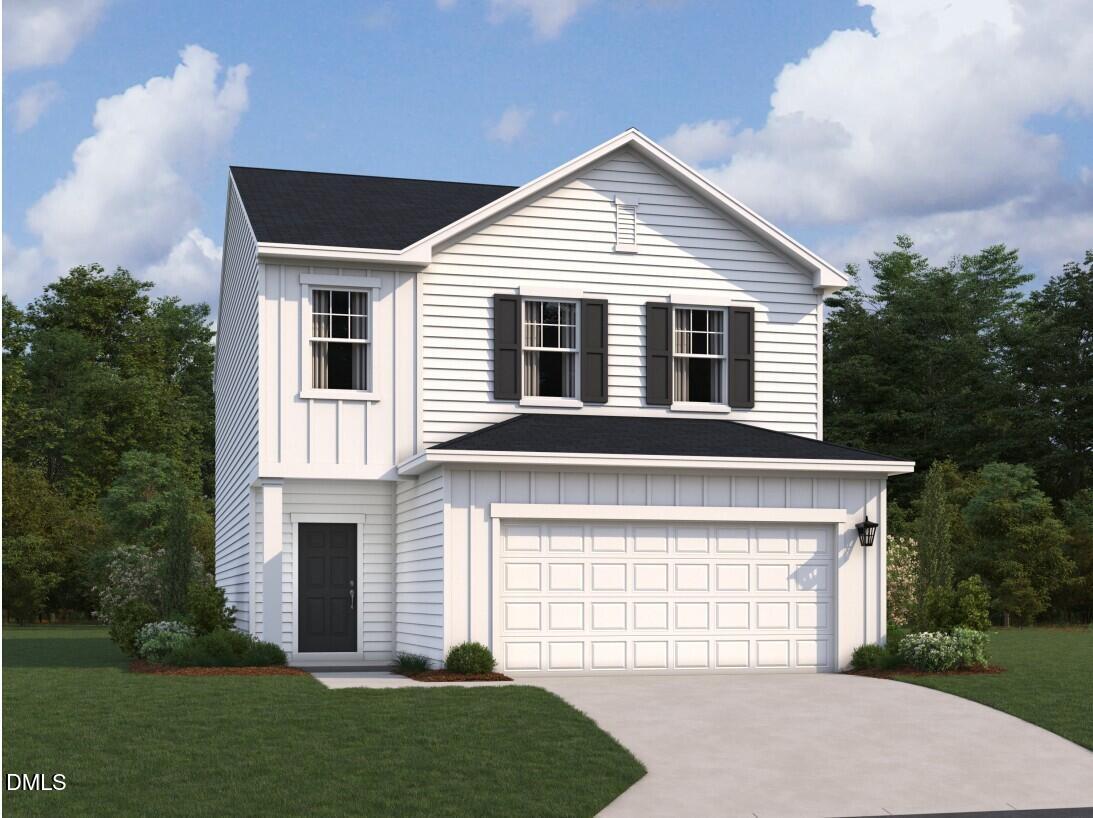 6739 Jersey Road, Unit 103 Middlesex, NC 27557 - Photo 1 of 7 a front view of a house with a yard and garage