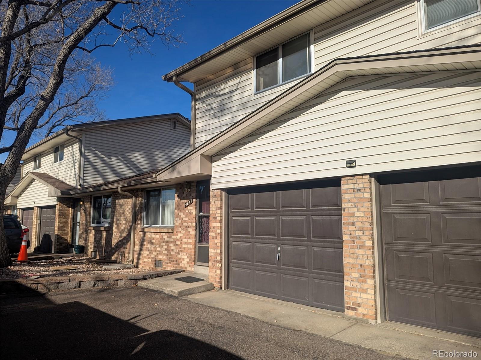 4643 Independence Street, Unit 9 Wheat Ridge, CO 80033 - Photo 11 of 11 a view of small house with a garage