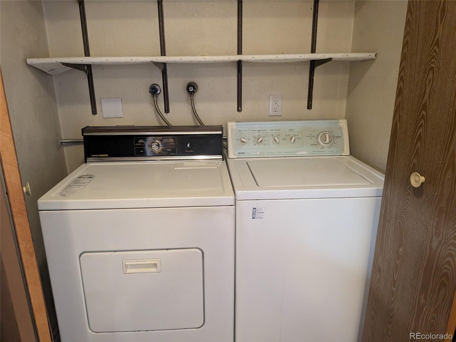 4643 Independence Street, Unit 9 Wheat Ridge, CO 80033 - Photo 5 of 11 a utility room with dryer and washer