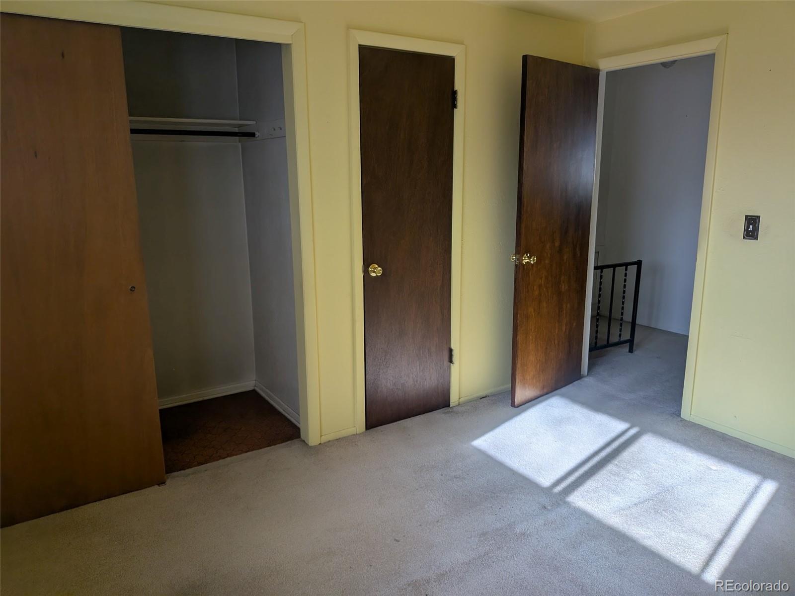 4643 Independence Street, Unit 9 Wheat Ridge, CO 80033 - Photo 10 of 11 an empty room with closet