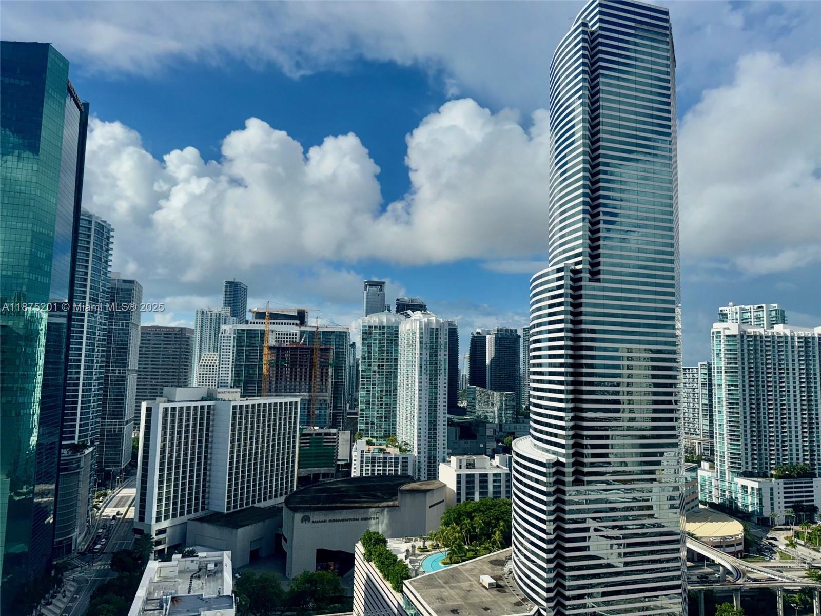 151 Southeast 1st Street, Unit 2807 Miami, FL 33131 - Photo 11 of 24 a view of a balcony with many windows