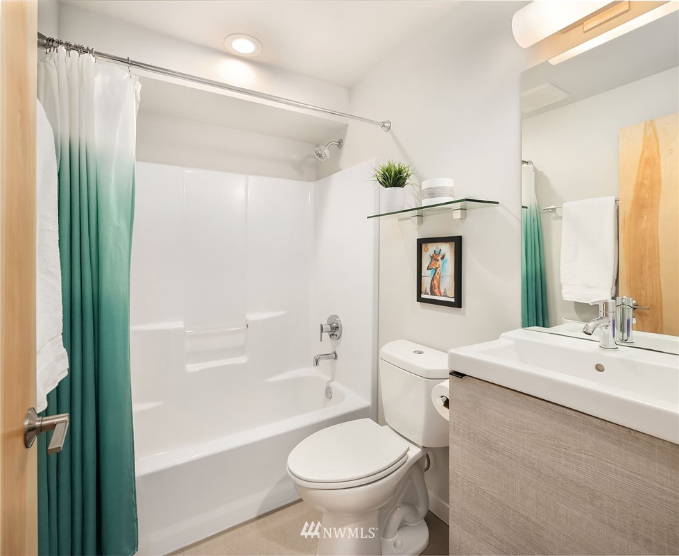983 North 45th Street Seattle, WA 98103 - Photo 18 of 32 a bathroom with a sink toilet and shower