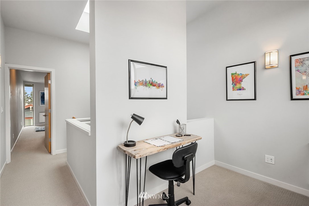 983 North 45th Street Seattle, WA 98103 - Photo 24 of 32 a view of a workspace with furniture and wooden floor