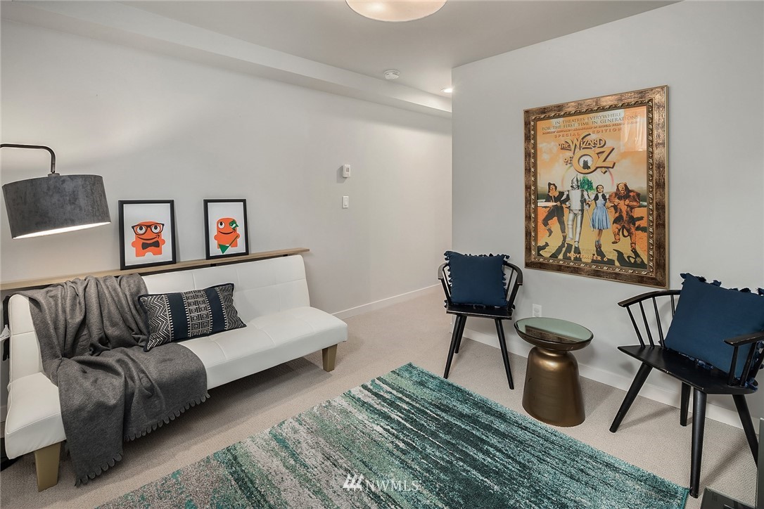 983 North 45th Street Seattle, WA 98103 - Photo 28 of 32 a living room with furniture and a painting on the wall