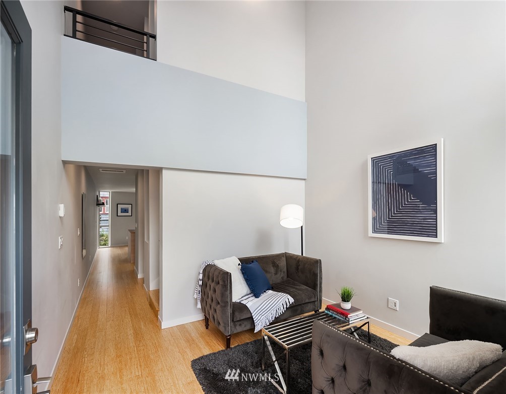 983 North 45th Street Seattle, WA 98103 - Photo 6 of 32 a living room with furniture and a wooden floor