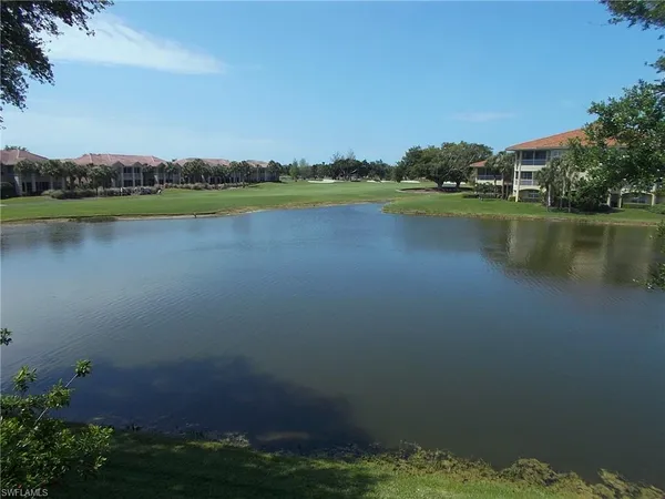 a view of a lake with a big yard