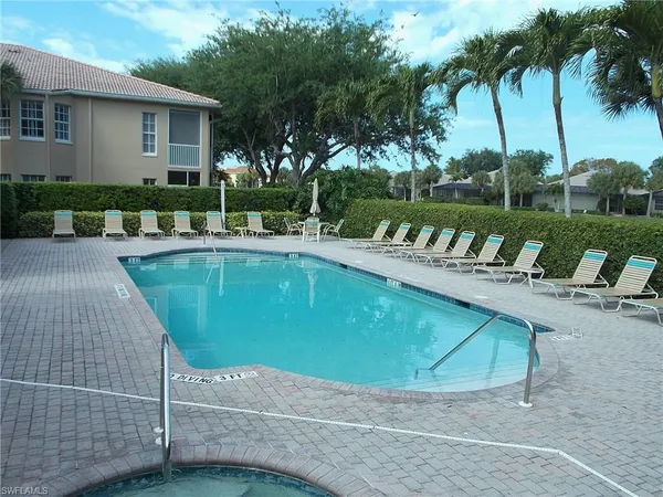 a view of a swimming pool with a patio