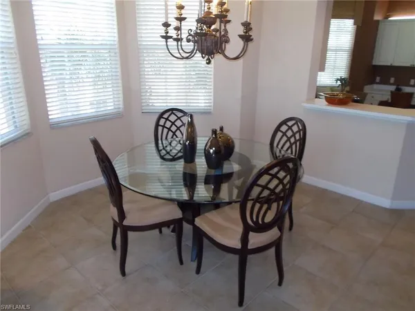 a view of a dining room with furniture and window