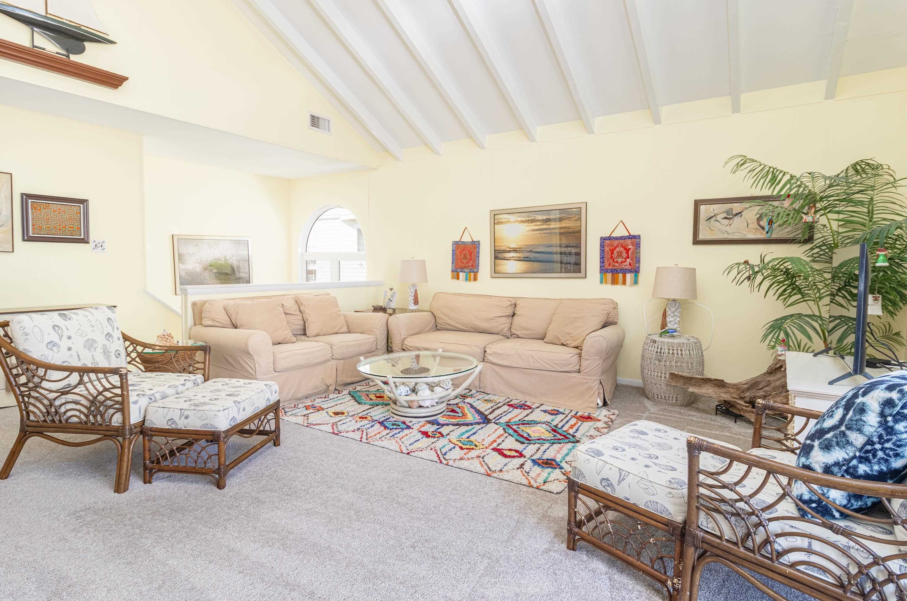 181 7th Street Avalon, NJ 08202 - Photo 11 of 29 a living room with furniture and a table