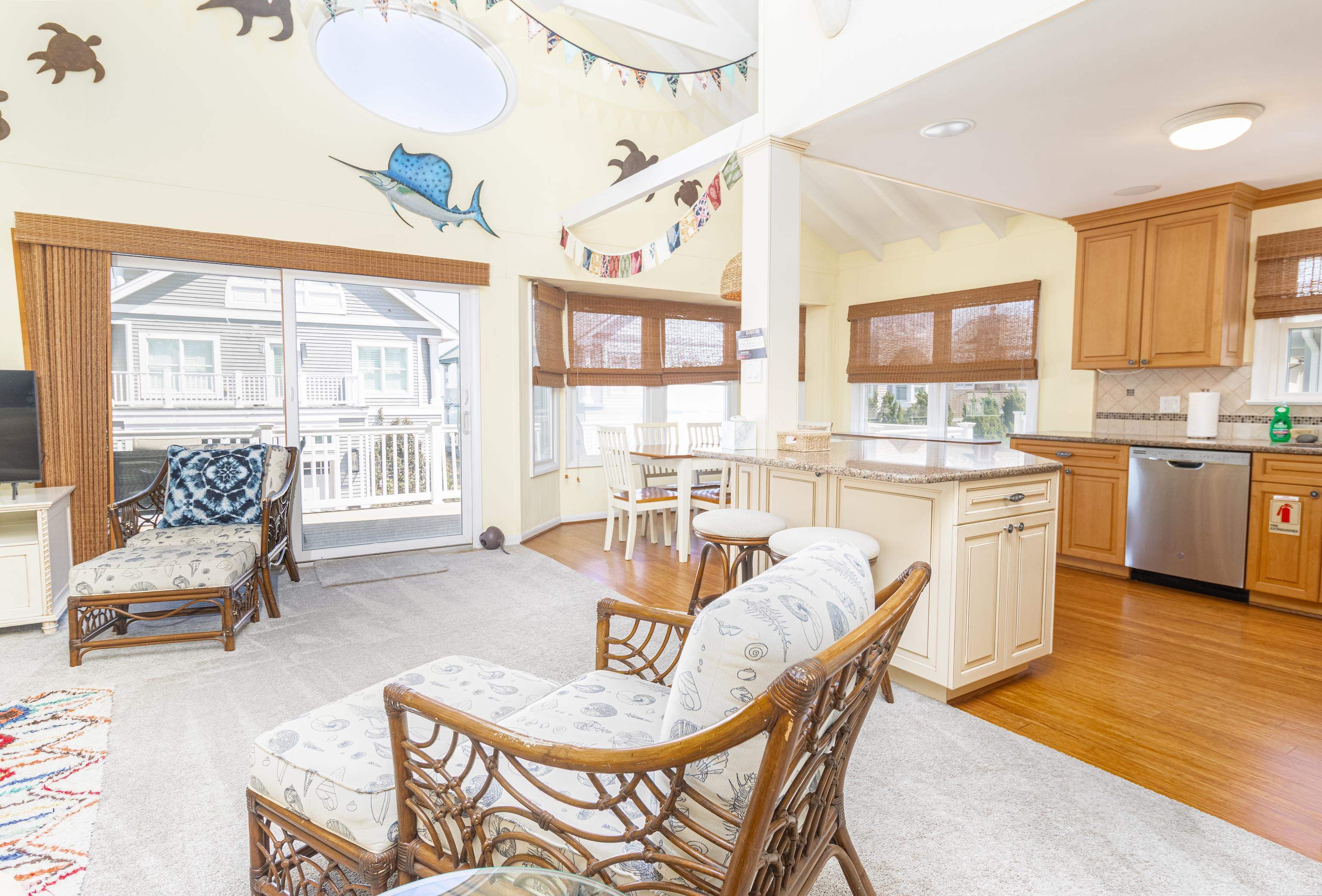 181 7th Street Avalon, NJ 08202 - Photo 16 of 29 a dining room with furniture and a large window