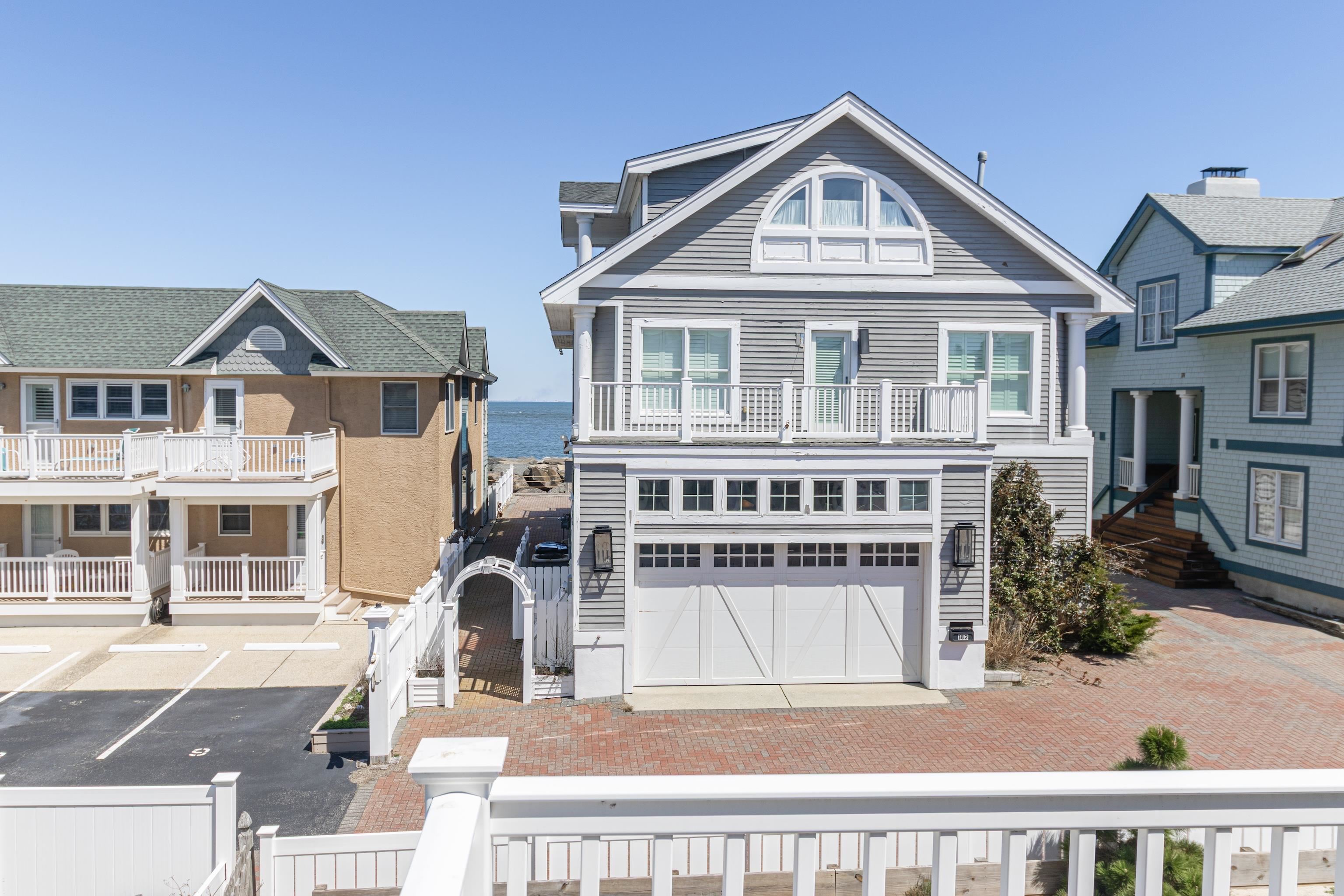 181 7th Street Avalon, NJ 08202 - Photo 20 of 29 a front view of a house with a yard