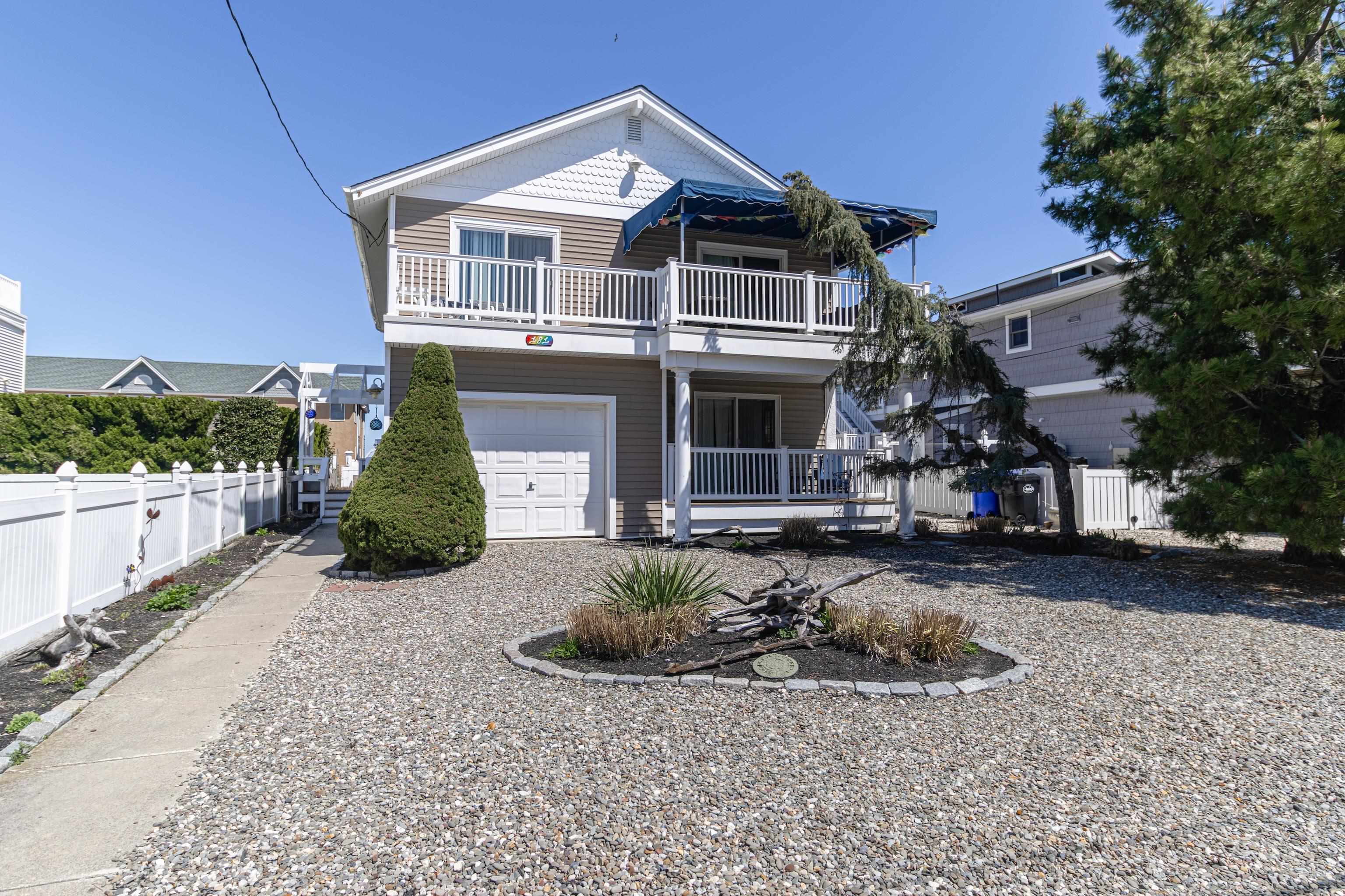 181 7th Street Avalon, NJ 08202 - Photo 2 of 29 a front view of a house with a yard