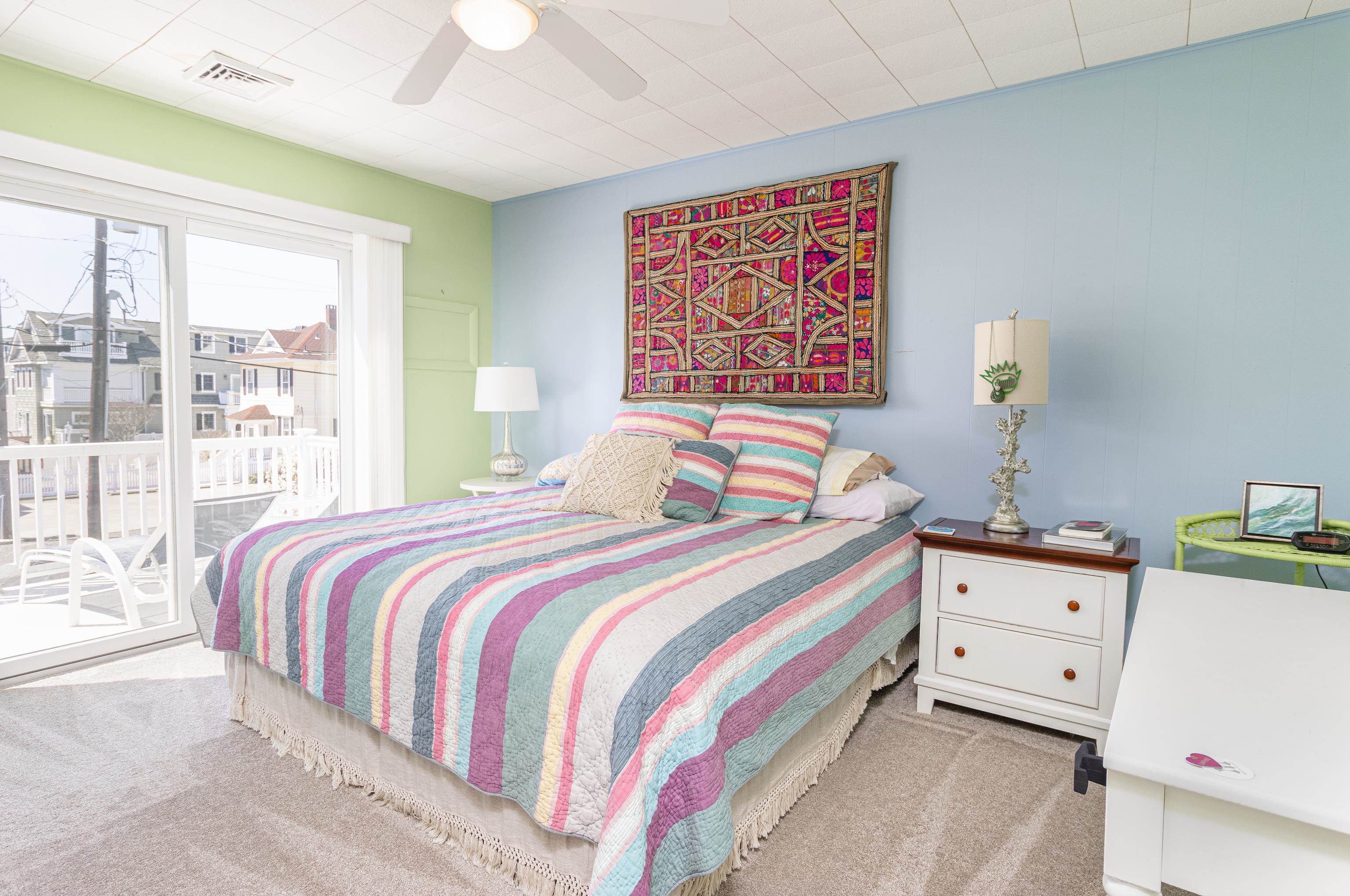 181 7th Street Avalon, NJ 08202 - Photo 22 of 29 a bedroom with a bed and wooden floor