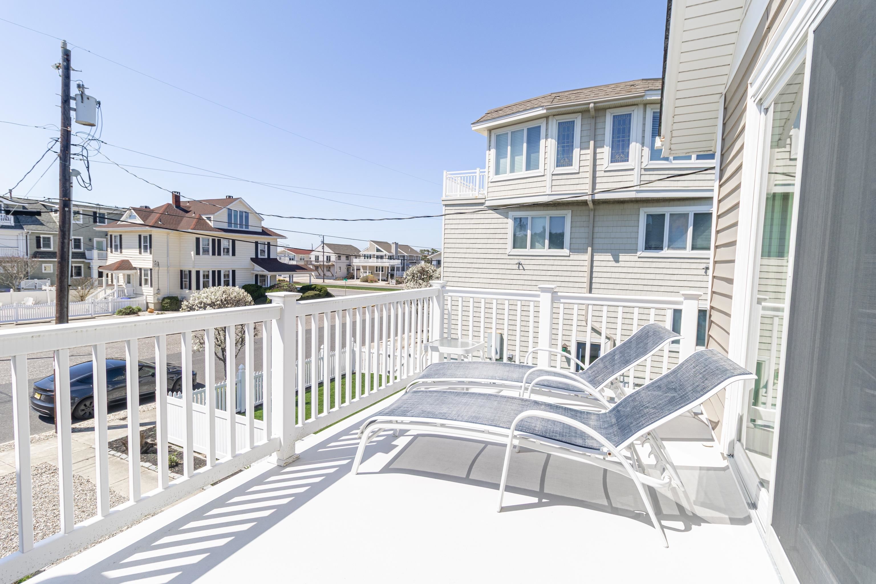 181 7th Street Avalon, NJ 08202 - Photo 28 of 29 a view of a balcony with table and chairs