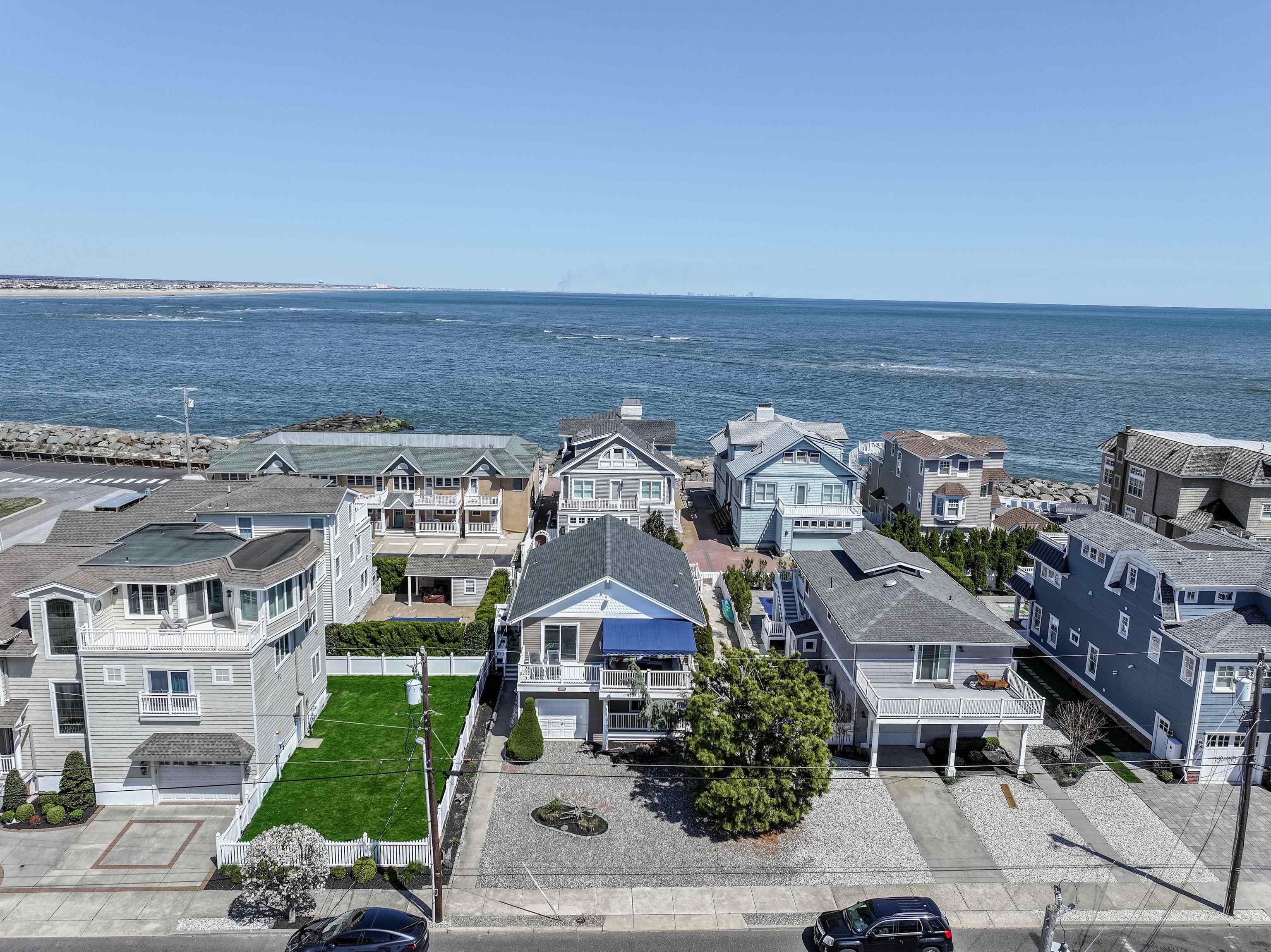 181 7th Street Avalon, NJ 08202 - Photo 3 of 29 an aerial view of multiple houses with a yard