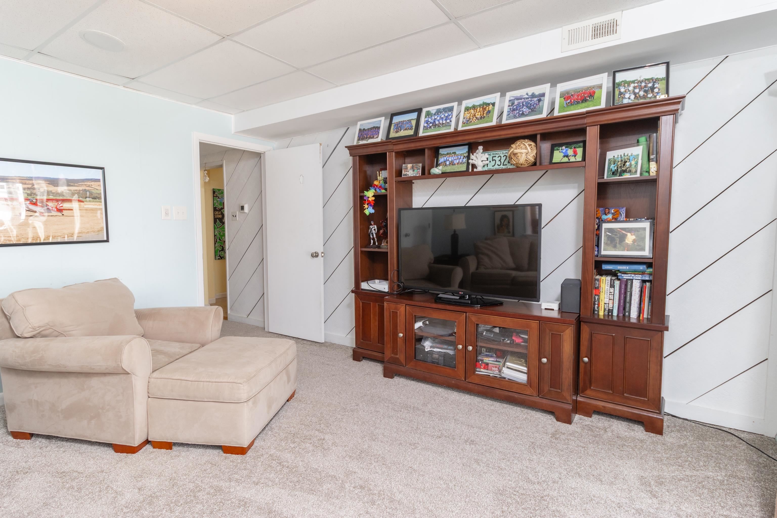 181 7th Street Avalon, NJ 08202 - Photo 7 of 29 a living room with furniture and a flat screen tv