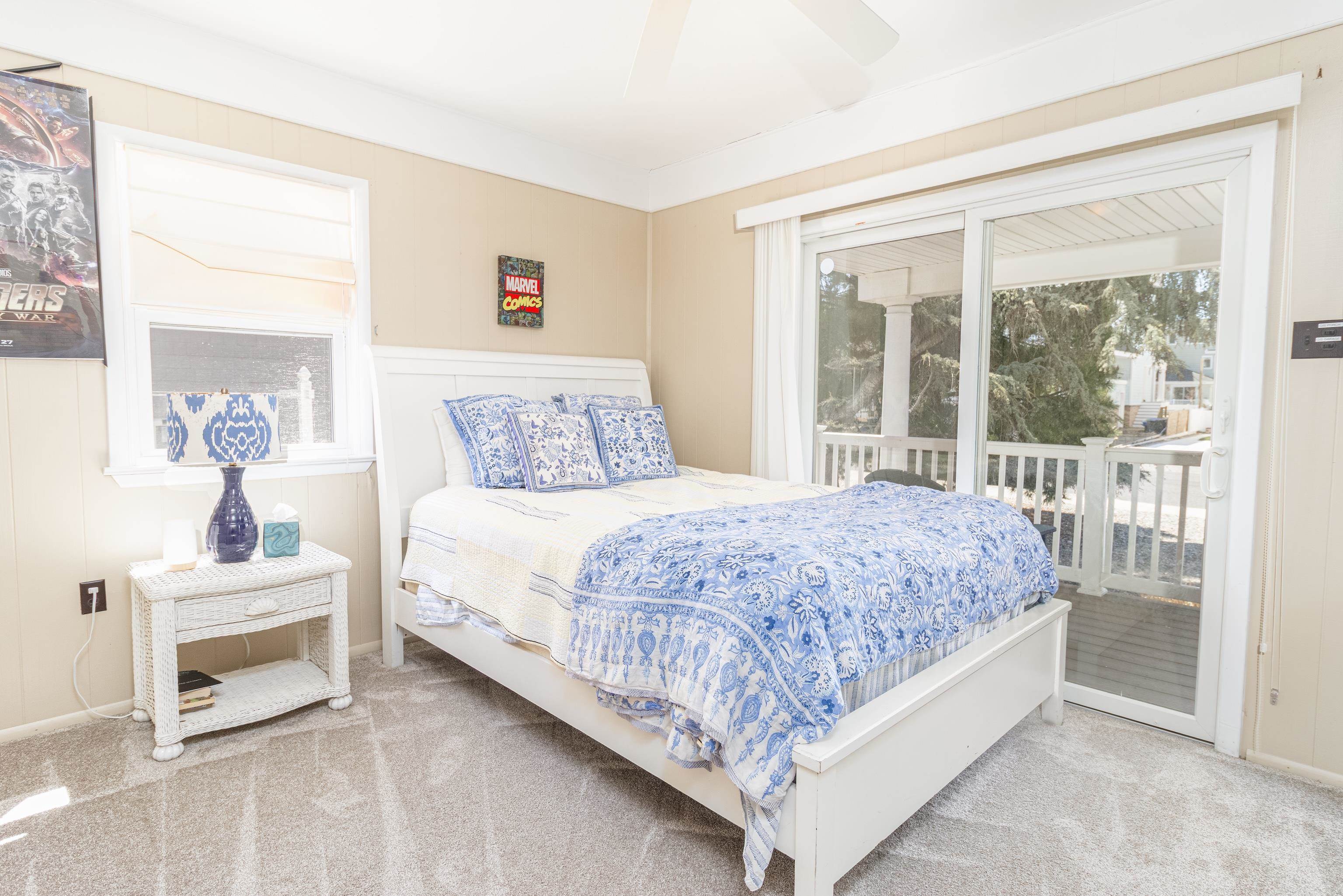 181 7th Street Avalon, NJ 08202 - Photo 8 of 29 a bedroom with a bed and a large window