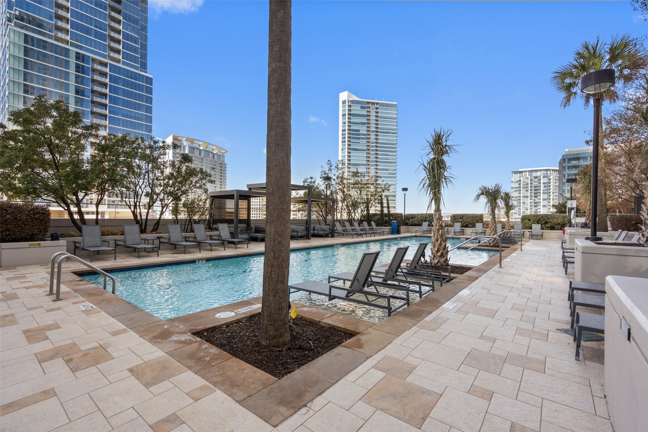 360 Nueces Street, Unit 1405 Austin, TX 78701 - Photo 38 of 40 a view of swimming pool with outdoor seating and plants