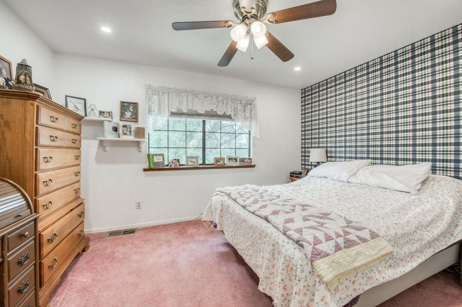 30128 Auberry Road Prather, CA 93651 - Photo 16 of 99 a bedroom with a bed and a window