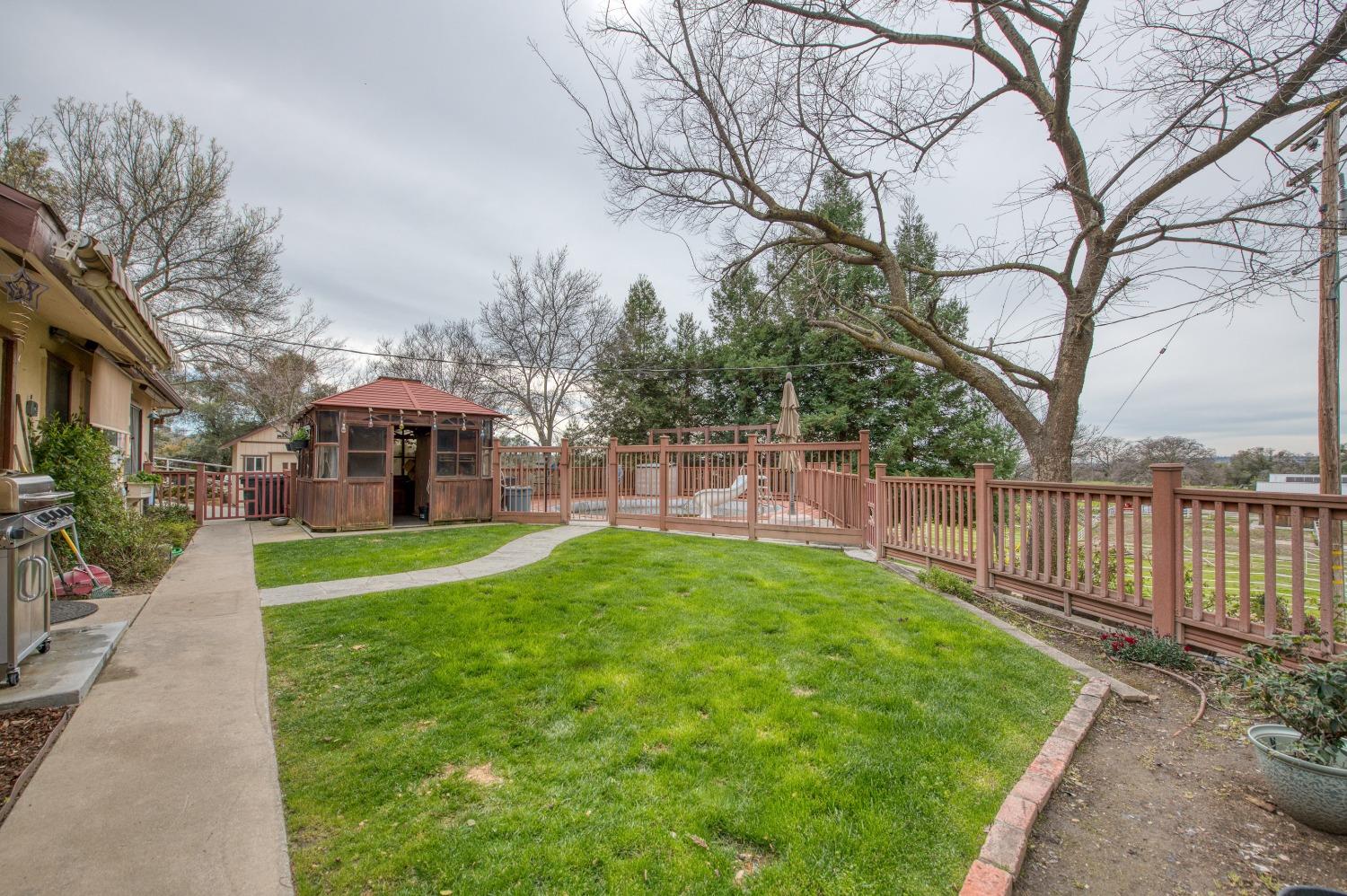 30128 Auberry Road Prather, CA 93651 - Photo 18 of 99 a view of a house with backyard and a tree