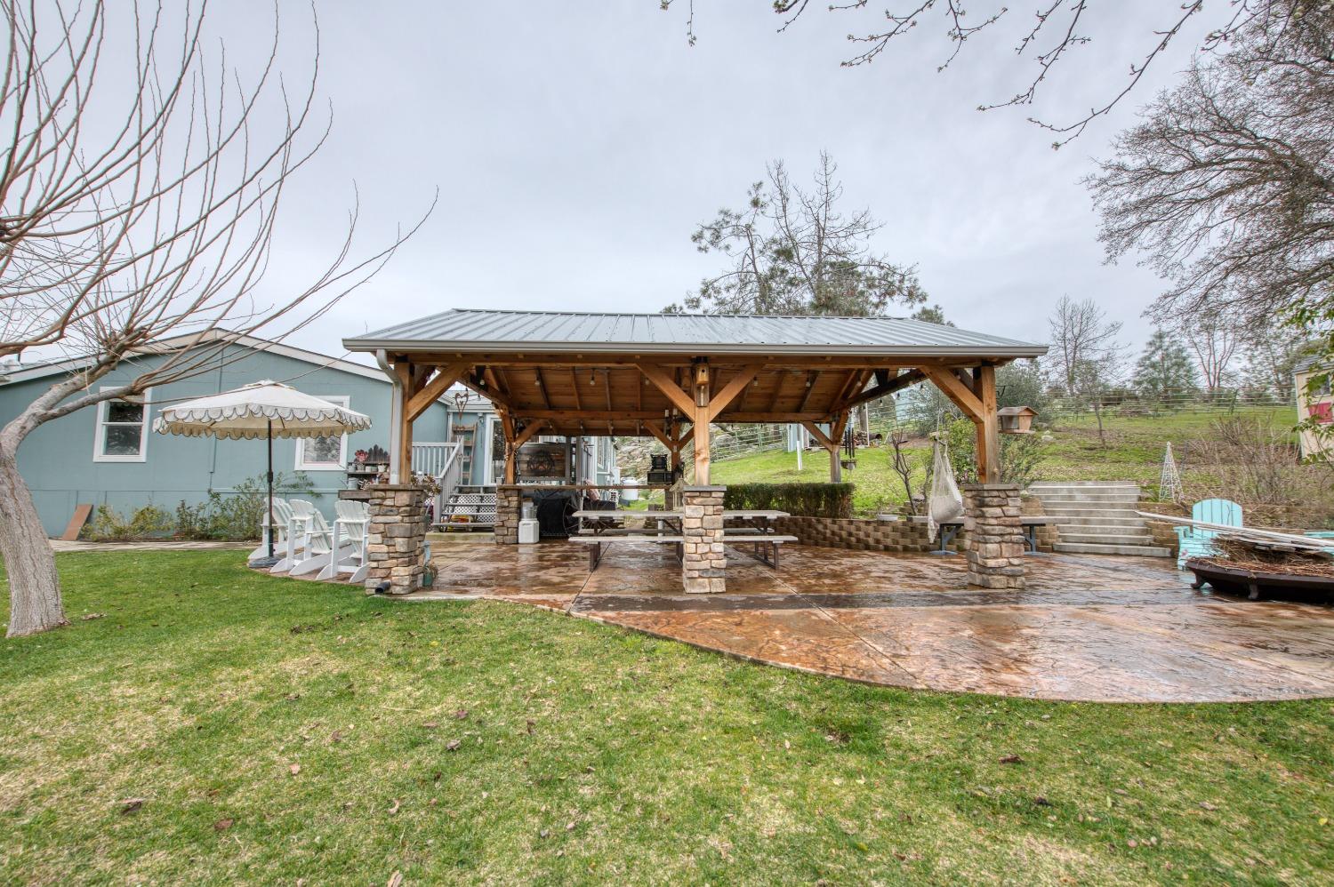 30128 Auberry Road Prather, CA 93651 - Photo 54 of 99 a view of a swimming pool with a patio and a yard