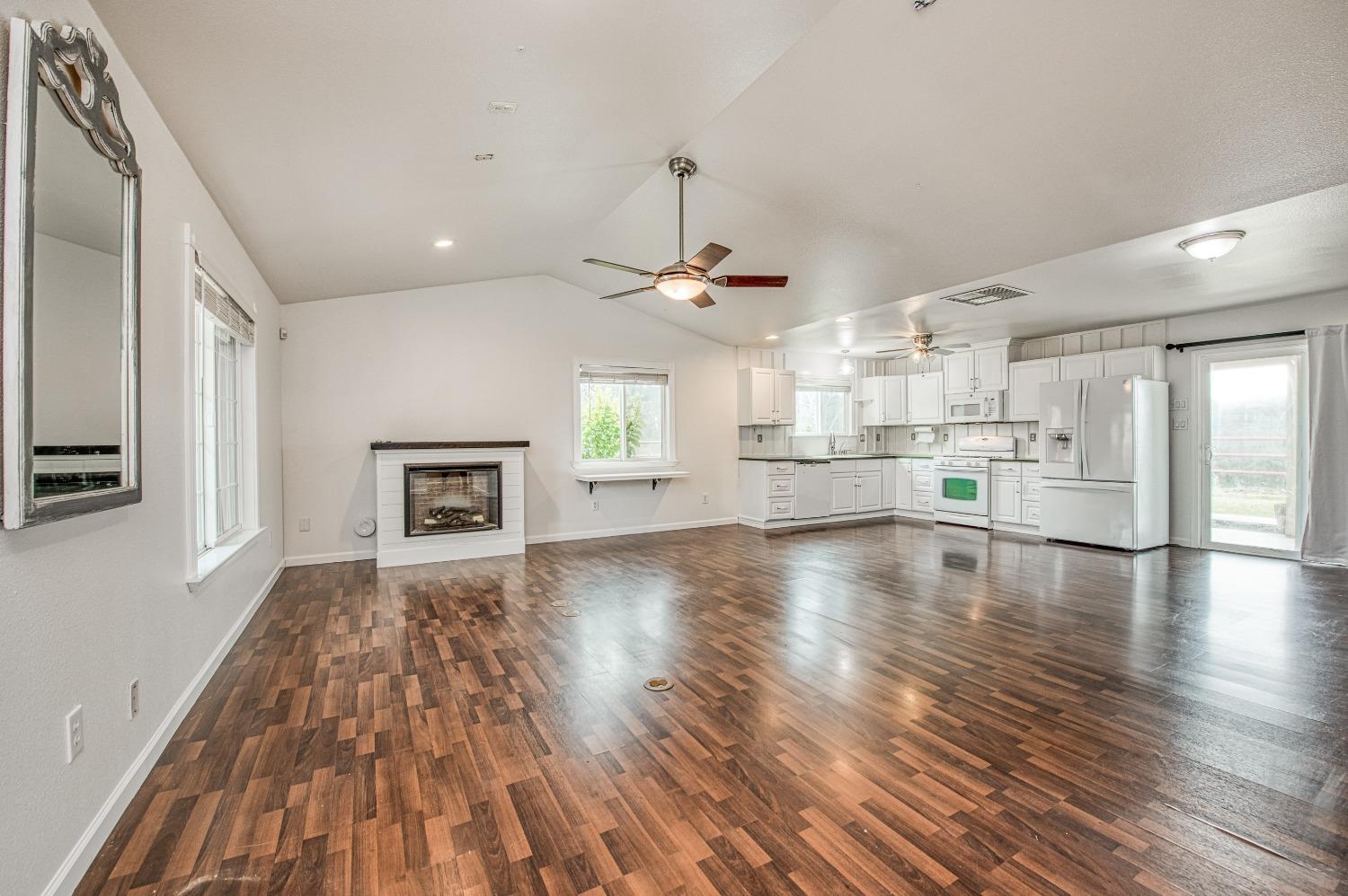 30128 Auberry Road Prather, CA 93651 - Photo 61 of 99 a view of an empty room with a window and wooden floor