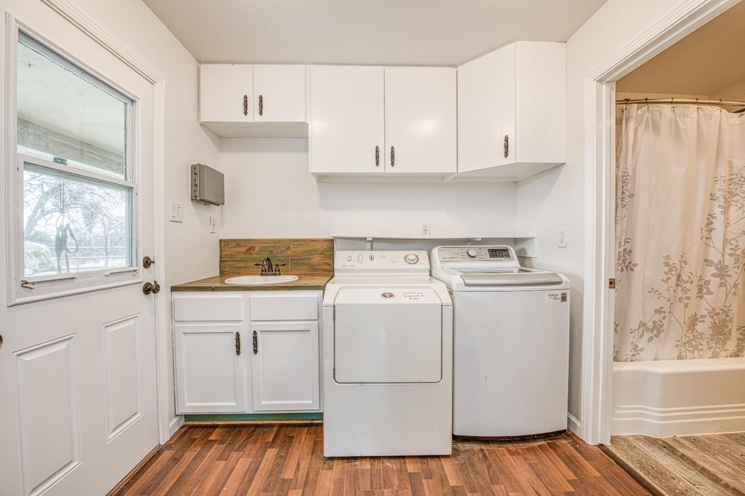 30128 Auberry Road Prather, CA 93651 - Photo 64 of 99 a view of a kitchen with sink and wooden floor
