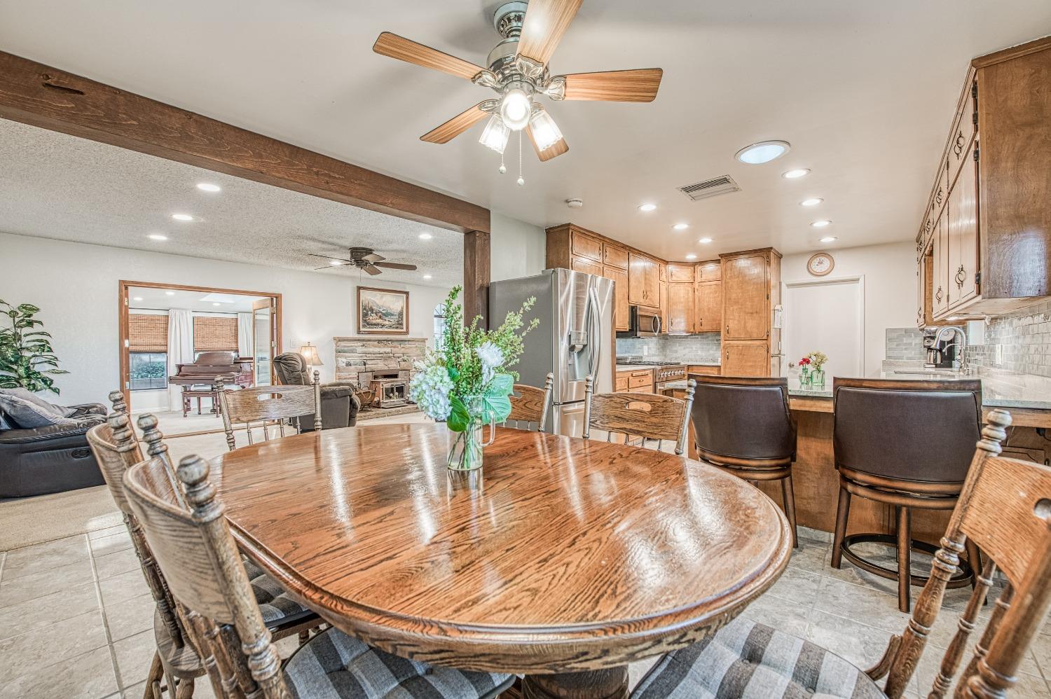30128 Auberry Road Prather, CA 93651 - Photo 8 of 99 a dining room with stainless steel appliances furniture a dining table and chairs