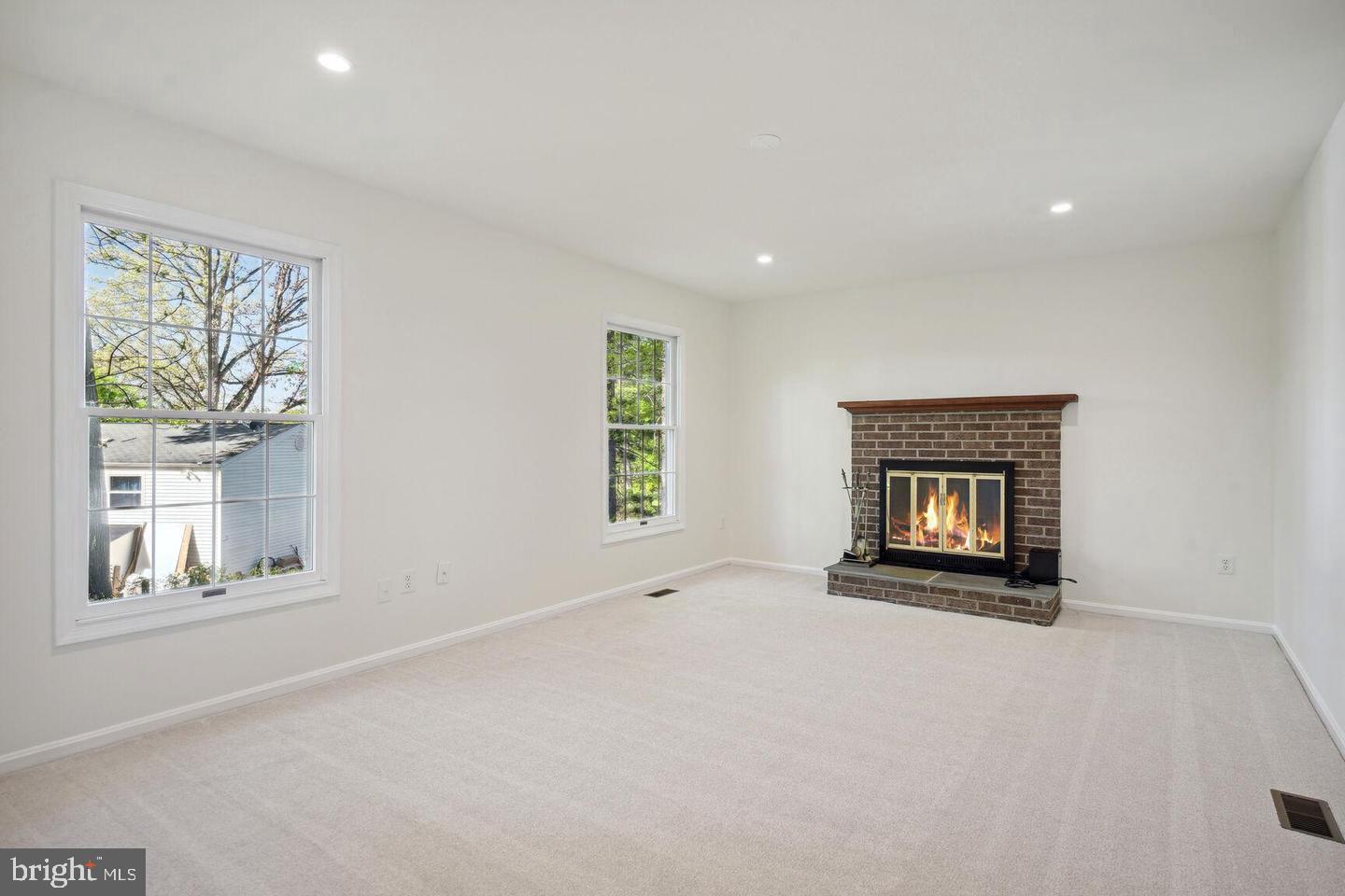 100 Summit Hall Road Gaithersburg, MD 20877 - Photo 9 of 28 Family room with wood burning fireplace