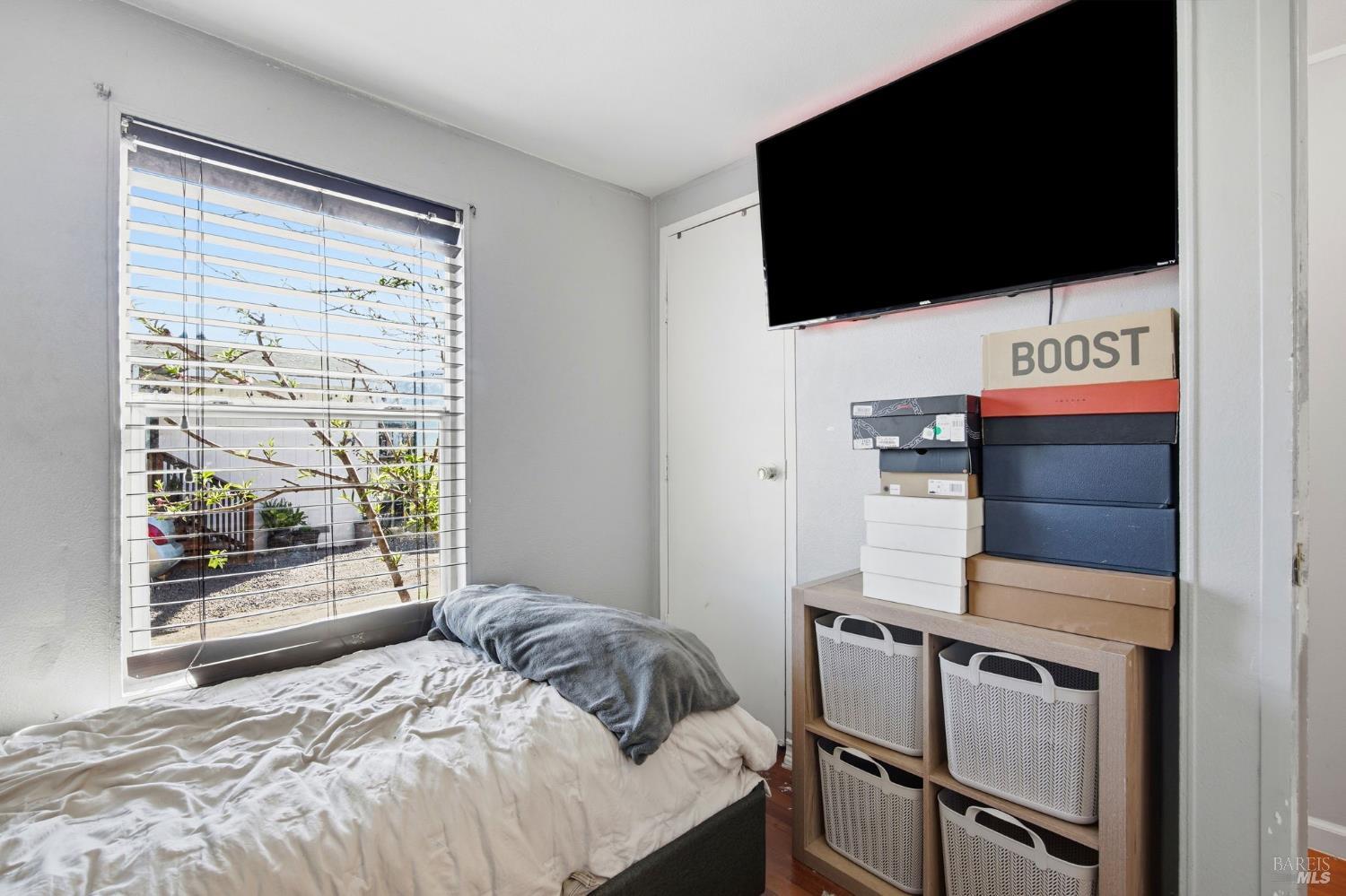 2963 Santa Rosa Avenue, Unit B2 Santa Rosa, CA 95407 - Photo 20 of 32 a bedroom with a bed and a television