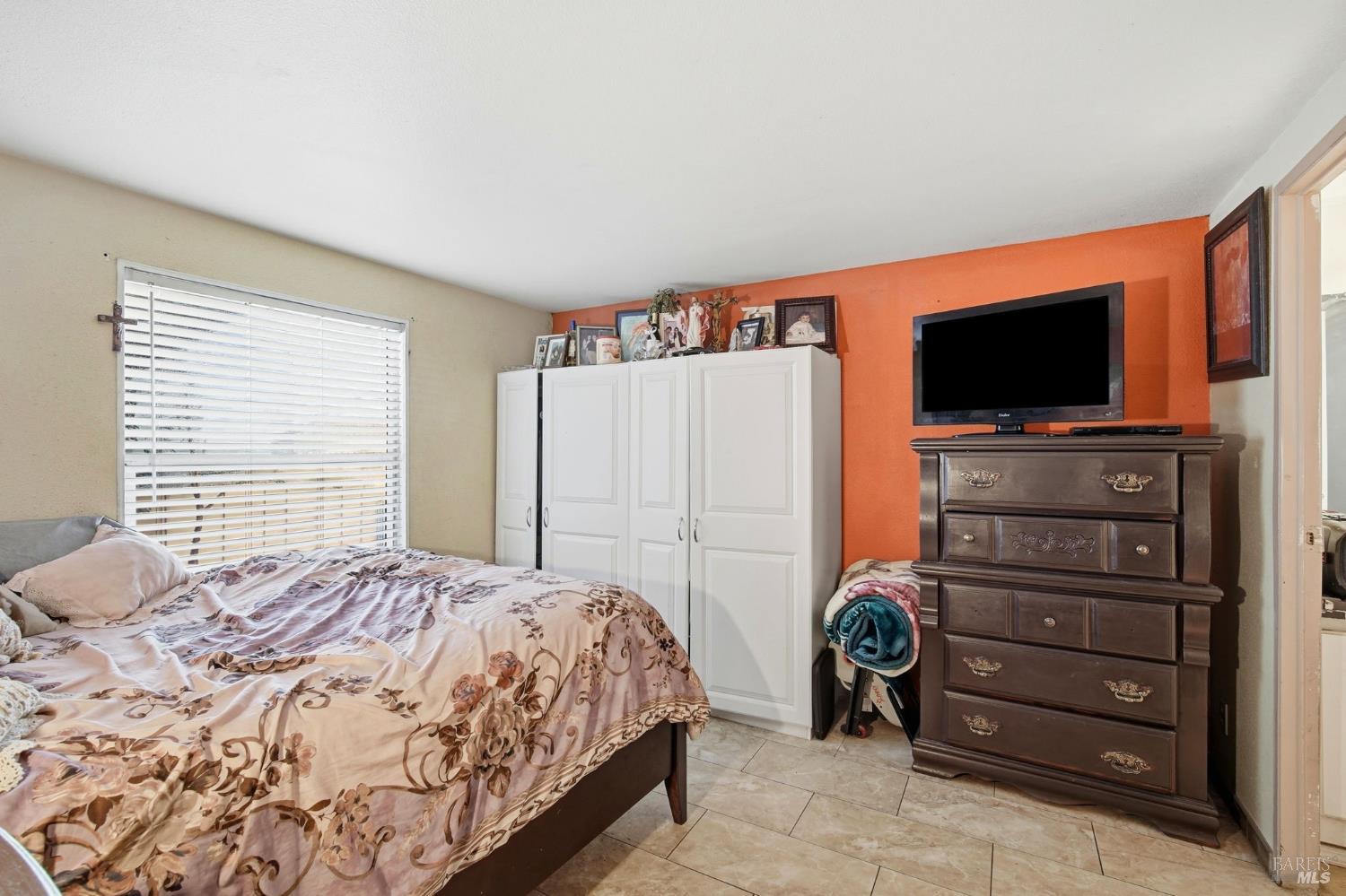 2963 Santa Rosa Avenue, Unit B2 Santa Rosa, CA 95407 - Photo 21 of 32 a bedroom with a bed and a flat screen tv
