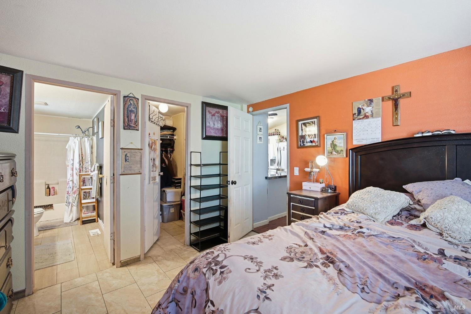 2963 Santa Rosa Avenue, Unit B2 Santa Rosa, CA 95407 - Photo 23 of 32 a bedroom with a bed and a television