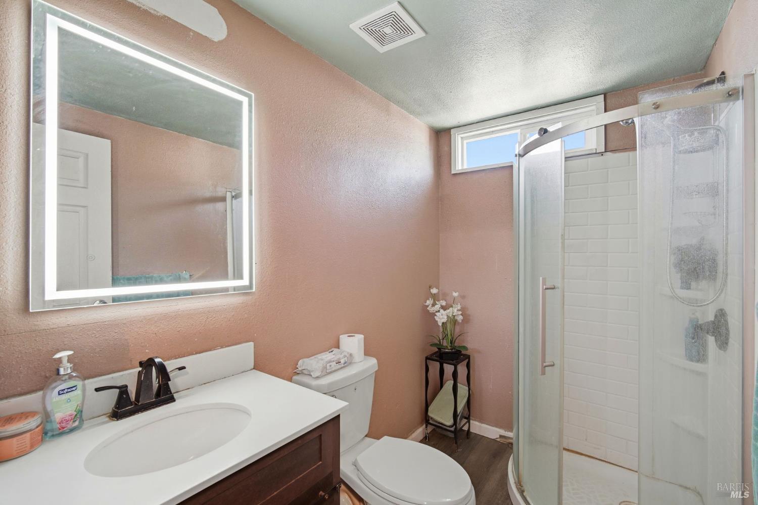 2963 Santa Rosa Avenue, Unit B2 Santa Rosa, CA 95407 - Photo 24 of 32 a bathroom with a sink toilet and shower