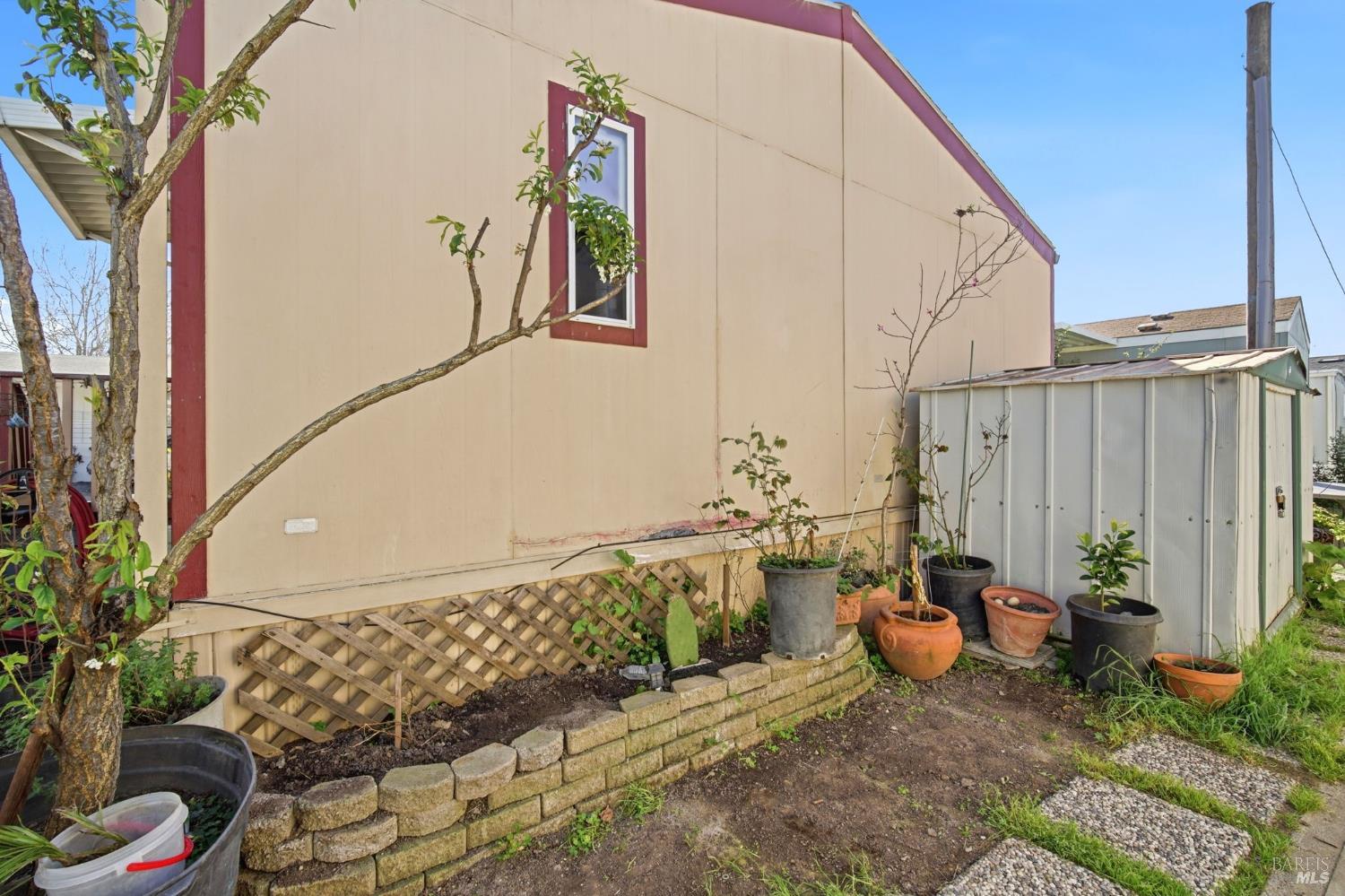 2963 Santa Rosa Avenue, Unit B2 Santa Rosa, CA 95407 - Photo 28 of 32 a view of a patio with table and chairs potted plants