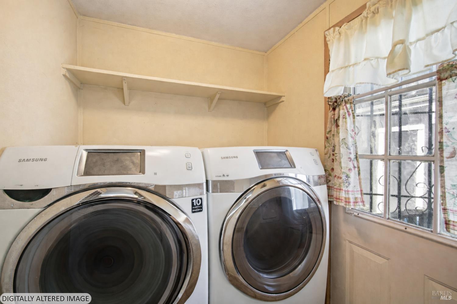 2963 Santa Rosa Avenue, Unit B2 Santa Rosa, CA 95407 - Photo 32 of 32 a view of washer and dryer with kitchen in the background
