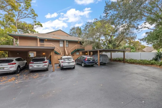a view of a cars parked in front of a house