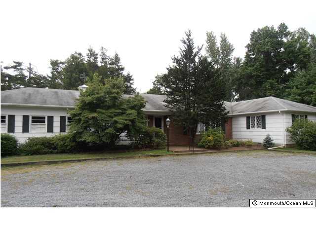 89 Rumson Road Rumson, NJ 07760 - Photo 1 of 9 a black and white house with a yard
