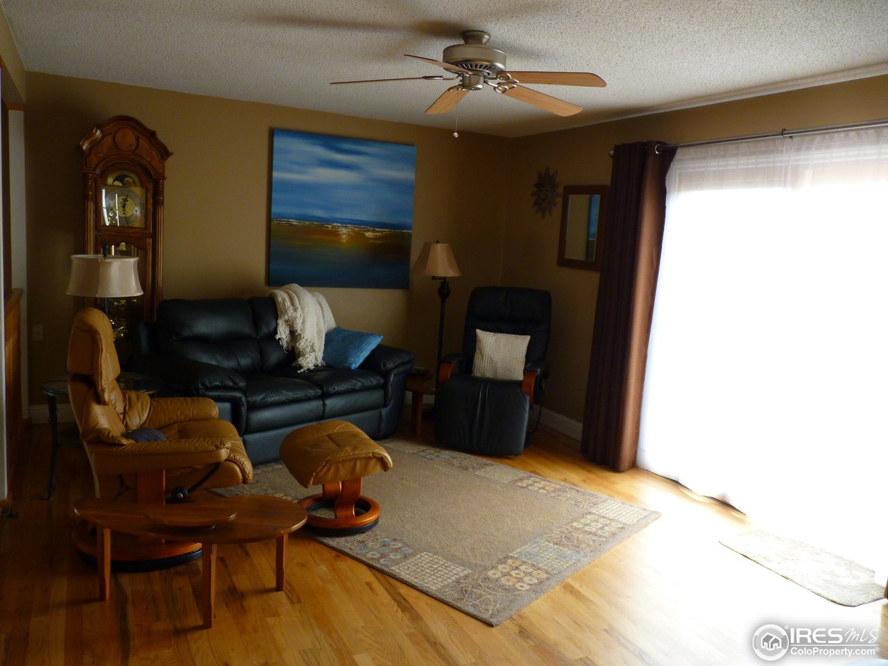 813 Gould Road Berthoud, CO 80513 - Photo 11 of 25 Living Room w/slider to deck