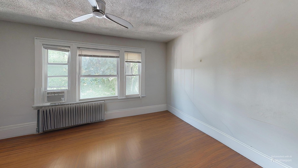1789 Commonwealth Avenue, Unit 2 Boston, MA 02135 - Photo 13 of 16 an empty room with a window