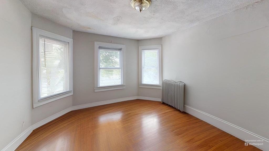 1789 Commonwealth Avenue, Unit 2 Boston, MA 02135 - Photo 2 of 16 an empty room with windows