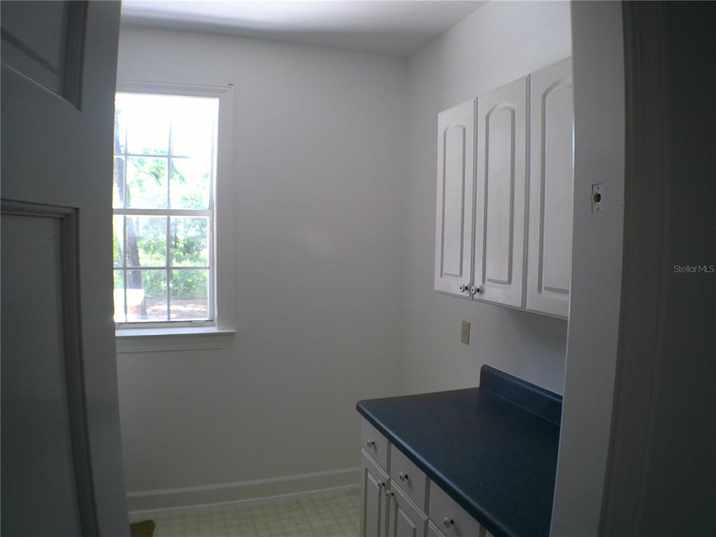 415 Southeast 123rd Street Road Ocala, FL 34480 - Photo 13 of 50 a view of kitchen with window