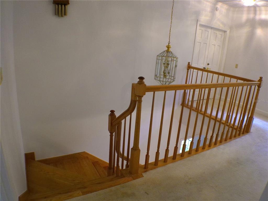 415 Southeast 123rd Street Road Ocala, FL 34480 - Photo 18 of 50 a view of a hallway with staircase