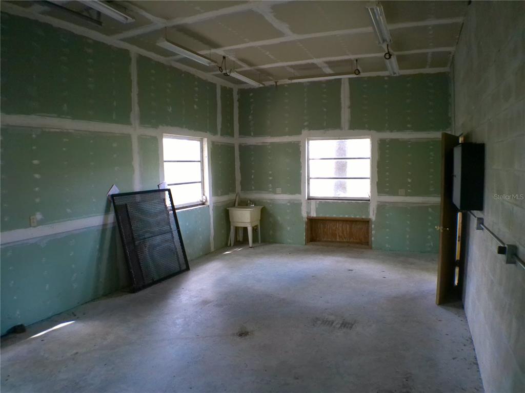 415 Southeast 123rd Street Road Ocala, FL 34480 - Photo 50 of 50 a view of empty room with window and refrigerator