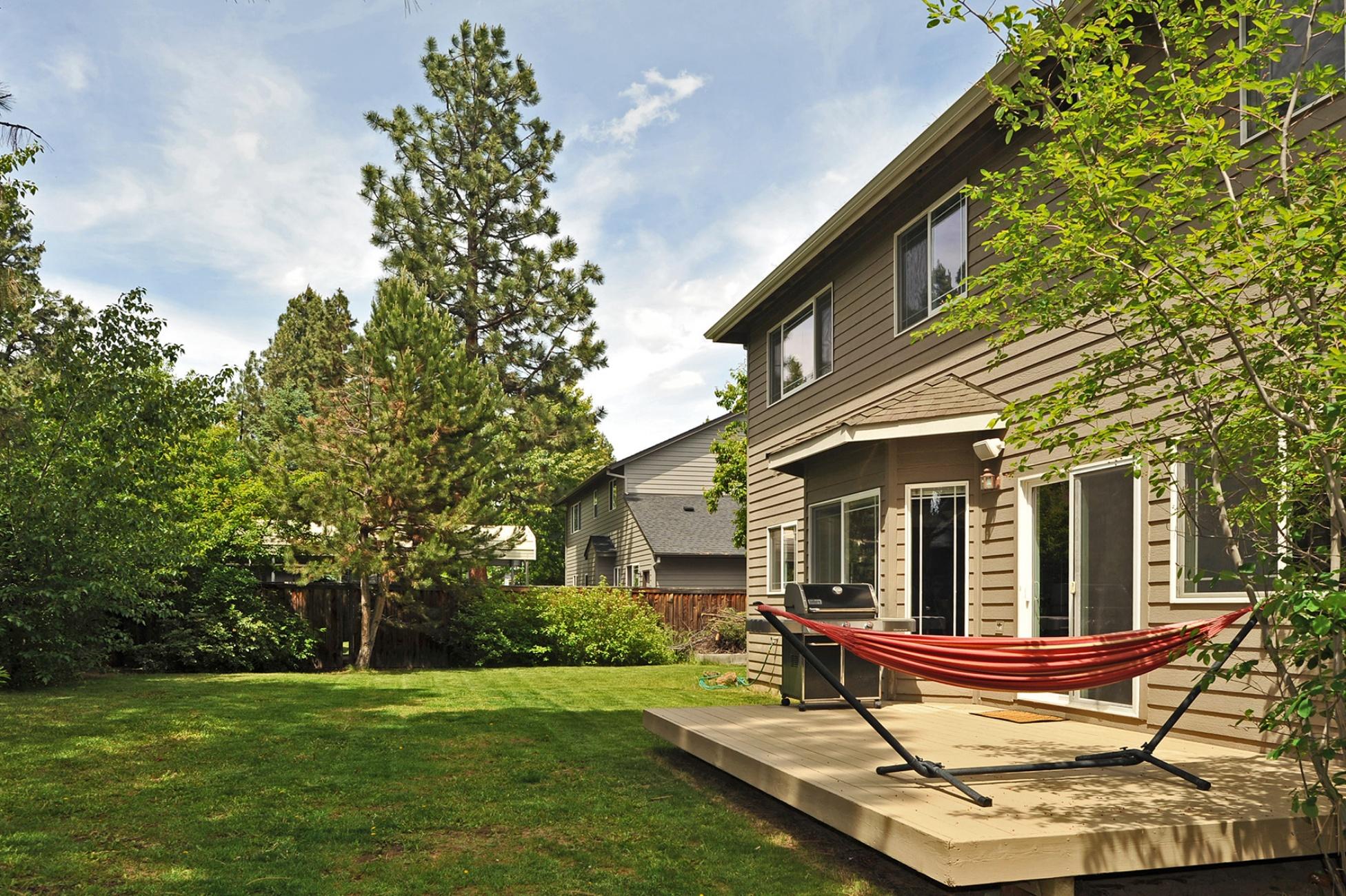 19834 Powers Road Bend, OR 97702 - Photo 8 of 22 Large, fenced & irrigated back yard offers the perfect canvas to create your dream outdoor living space.