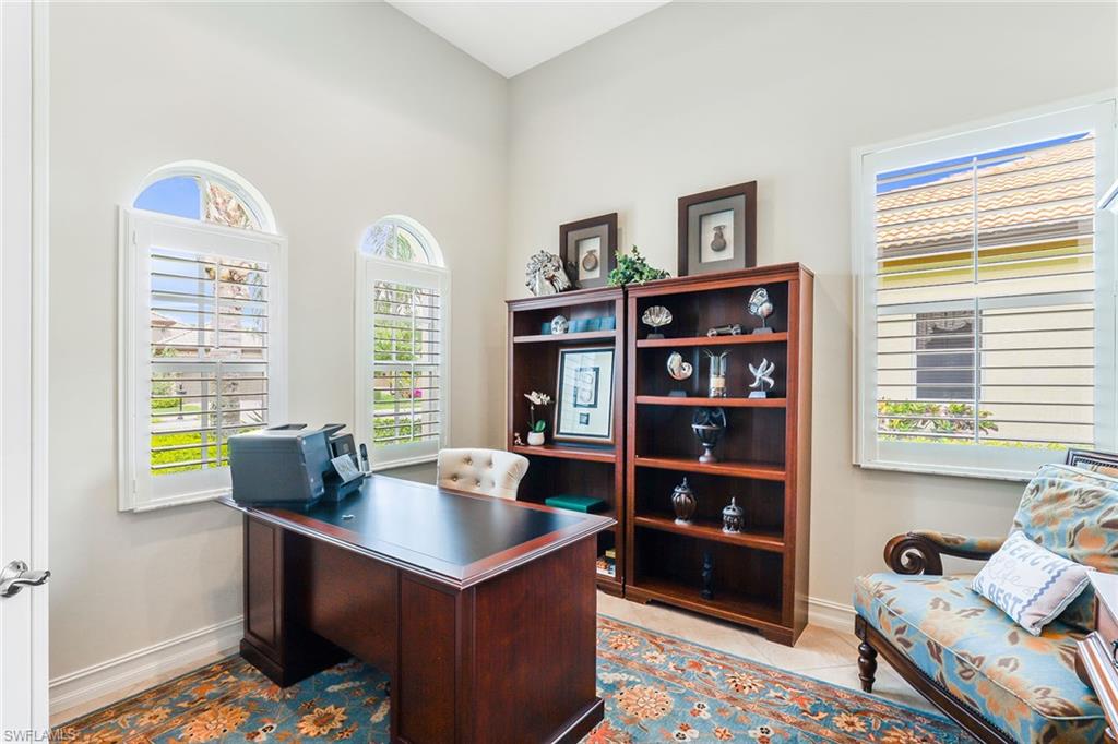 6581 Caldecott Drive Naples, FL 34113 - Photo 12 of 34 a room with furniture and a window