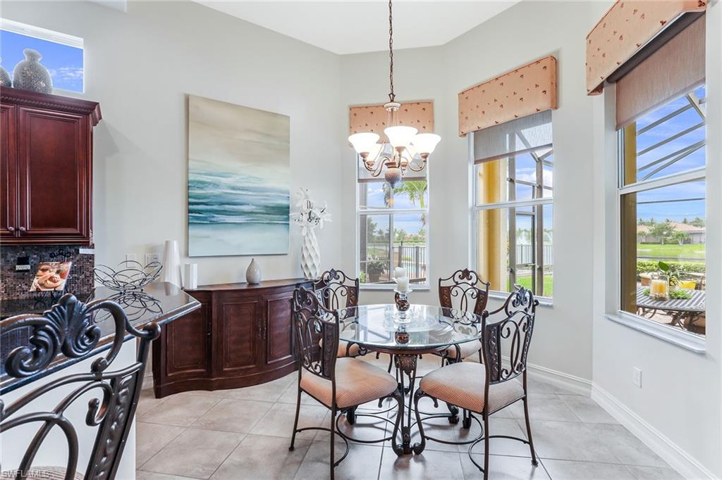 6581 Caldecott Drive Naples, FL 34113 - Photo 15 of 34 a view of a dining room with furniture window and outside view