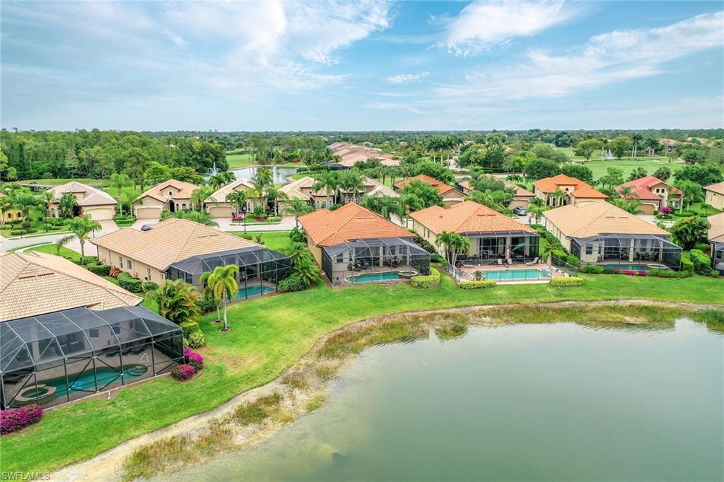 6581 Caldecott Drive Naples, FL 34113 - Photo 28 of 34 a view of houses with outdoor space and street view